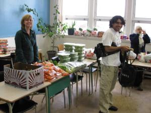 Tracy manning the produce section at the Immigrants Well-being Centre